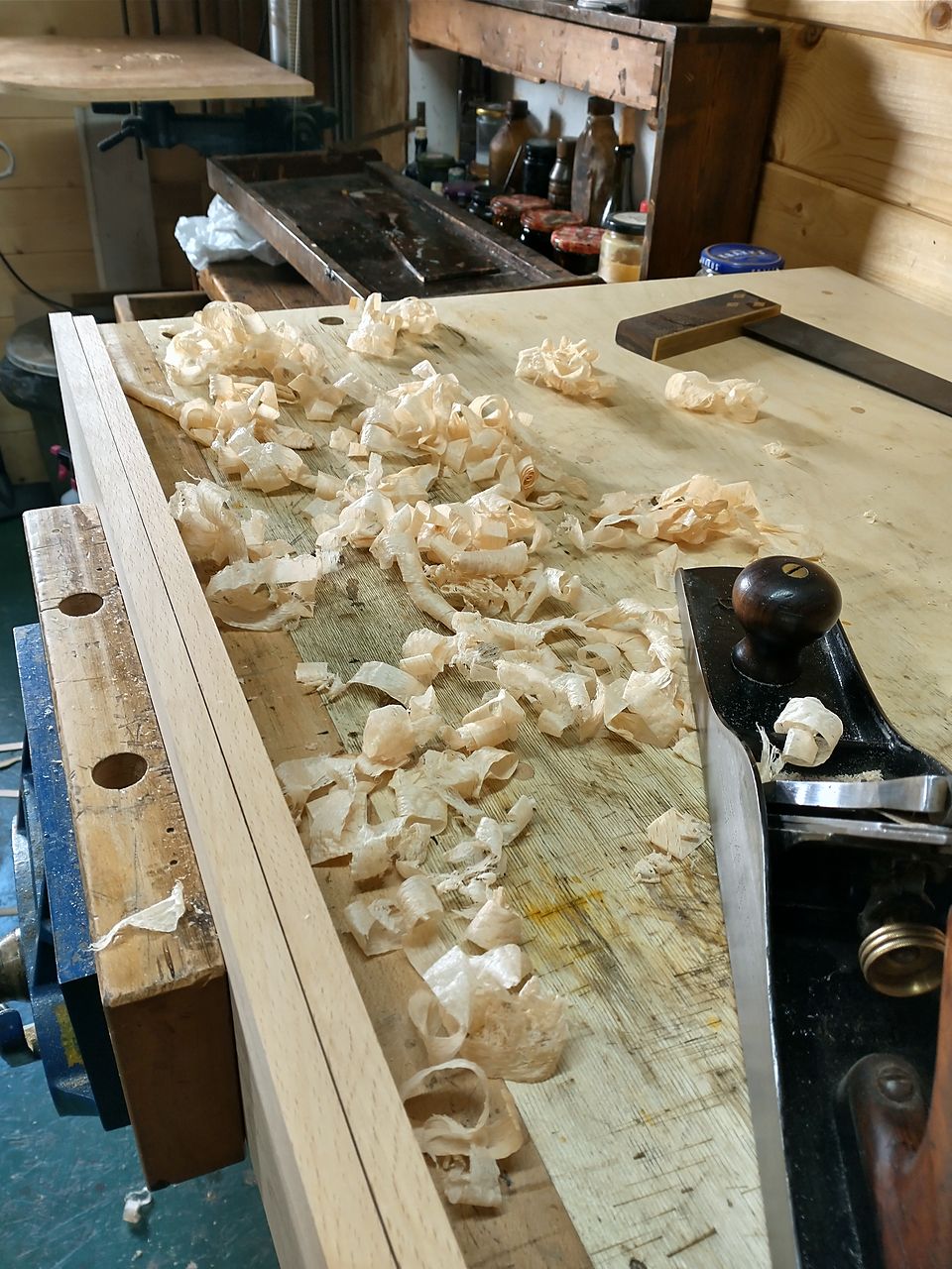 Craig's workshop: a hand plane and shavings on the bench